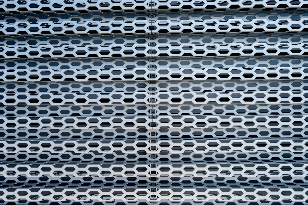 Seamless kaleidoscope wallpaper pattern — Medicine by wallpaper⁶ — base photo: a close up of a metal structure with holes