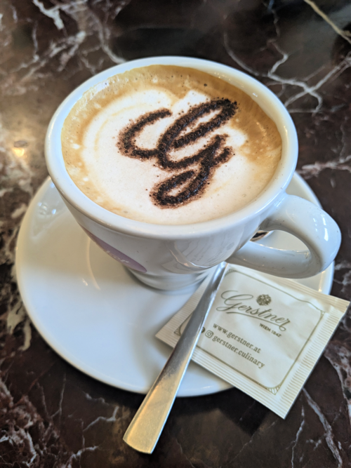 Seamless kaleidoscope wallpaper pattern — Calligraphy by wallpaper⁶ — base photo: File:Cappuccino with cursive G.png